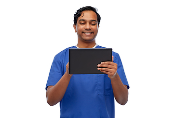 Image showing smiling doctor or male nurse using tablet computer