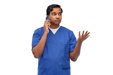 Image showing indian doctor or male nurse calling on smartphone