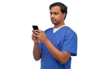 Image showing indian doctor or male nurse using smartphone