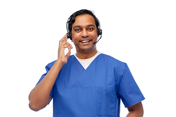 Image showing smiling indian doctor or male nurse with headset