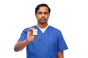 Image showing indian doctor or male nurse holding medicine