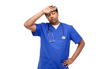 Image showing stressed doctor or male nurse in blue uniform