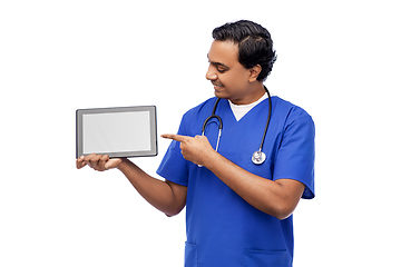 Image showing happy doctor or male nurse showing tablet computer