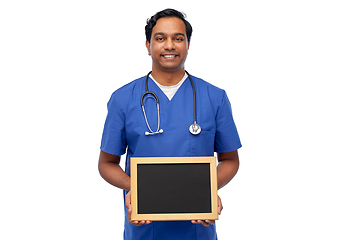 Image showing happy indian male doctor or nurse with chalkboard