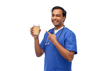 Image showing male doctor with stethoscope drinking coffee