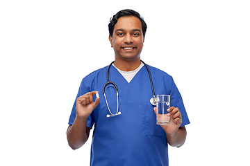 Image showing indian doctor with medicine and glass of water