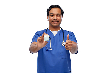 Image showing indian male doctor with medicine showing thumbs up