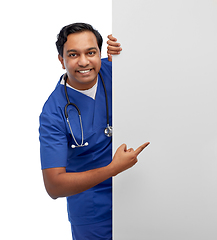 Image showing smiling male doctor or nurse with big white board