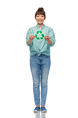 Image showing smiling asian woman holding green recycling sign