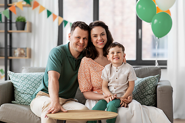 Image showing happy family with little son at home party