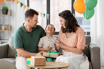 Image showing parents giving birthday present to little son