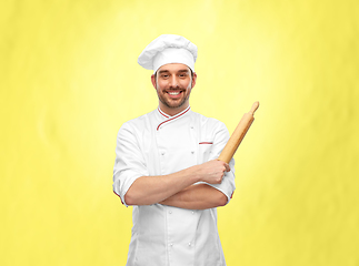 Image showing happy smiling male chef or baker with rolling pin