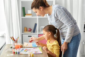 Image showing mother with little daughter drawing at home