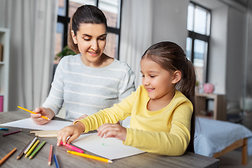 Image showing mother with little daughter drawing at home