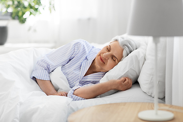 Image showing senior woman sleeping in bed at home bedroom