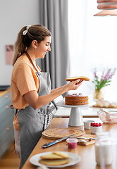 Image showing woman cooking food and baking on kitchen at home