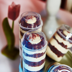 Image showing Selection of decorative desserts on buffet table at catered event