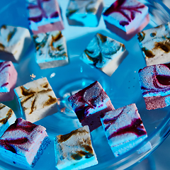 Image showing Selection of decorative desserts on buffet table at catered event