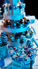 Image showing Selection of decorative desserts on buffet table at catered event