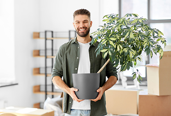 Image showing happy man with flower moving to new home