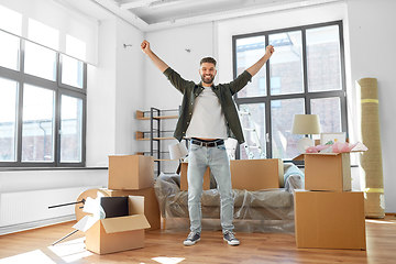 Image showing happy man with boxes moving to new home