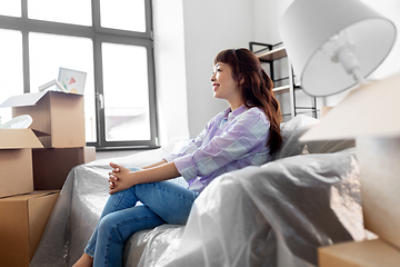 Image showing happy asian woman with stuff moving to new home