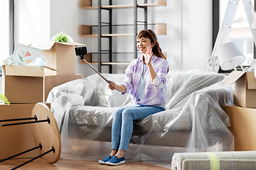 Image showing woman having video call and moving into new home