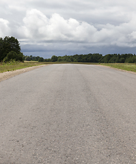 Image showing old dusty paved road