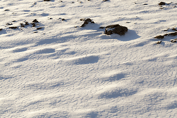 Image showing covered with snow plowed earth ,