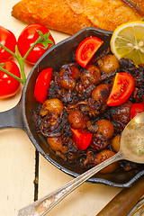 Image showing Baby cuttle fish roasted on iron skillet