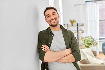 Image showing happy smiling man with crossed arms at home