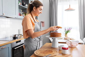 Image showing woman cooking food and baking on kitchen at home