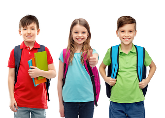 Image showing happy children with school bags showing thumbs up