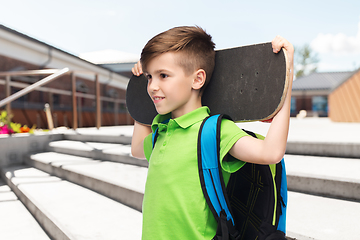 Image showing happy student boy with backpack and skateboard