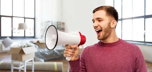 Image showing smiling man with megaphone talking over new home