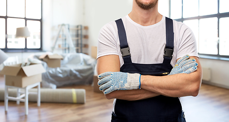 Image showing close up of builder in gloves at new home