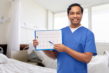 Image showing smiling male doctor with cardiogram on clipboard