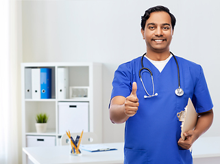 Image showing smiling doctor or male nurse showing thumbs up