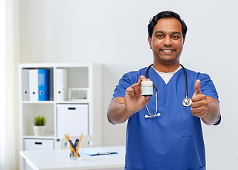 Image showing indian male doctor with medicine showing thumbs up