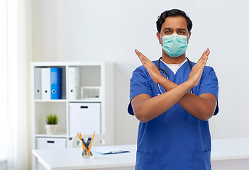 Image showing indian male doctor mask showing refusal gesture