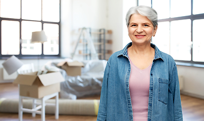 Image showing portrait of smiling senior woman at new home