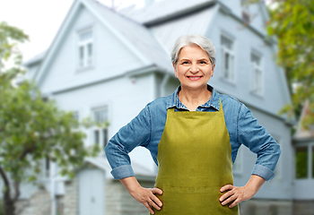 Image showing portrait of smiling senior woman in garden apron