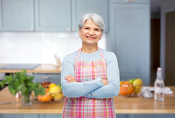 Image showing portrait of smiling senior woman at kitchen