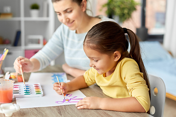 Image showing mother with little daughter drawing at home