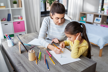 Image showing mother with little daughter drawing at home