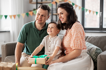 Image showing parents giving birthday present to little son