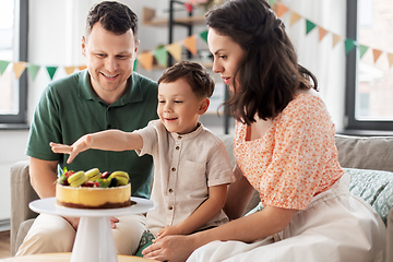 Image showing happy family with birthday cake at home