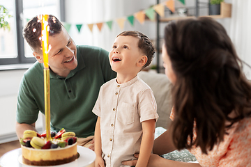 Image showing happy family with birthday cake at home