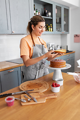 Image showing woman cooking food and baking on kitchen at home