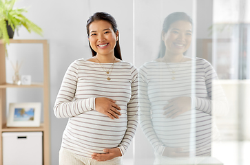 Image showing happy pregnant asian woman at home